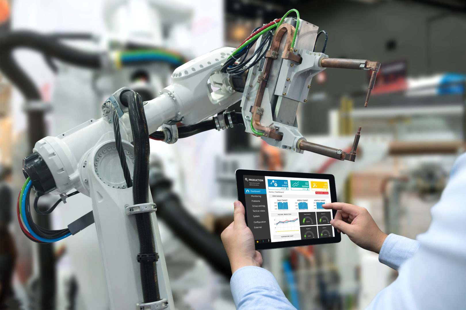 Engineer hand using tablet, heavy automation robot arm machine in smart factory industrial with tablet real time monitoring system application. Industry 4th iot concept. Engineer hand using tablet, heavy automation robot arm machine in smart factory industrial with tablet real time monitoring system application. Industry 4th iot concept.